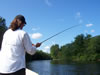 Lady drift boat fishing